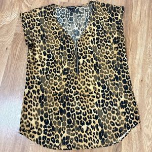 Lightly used Express silky leopard print with gold zipper size medium.
